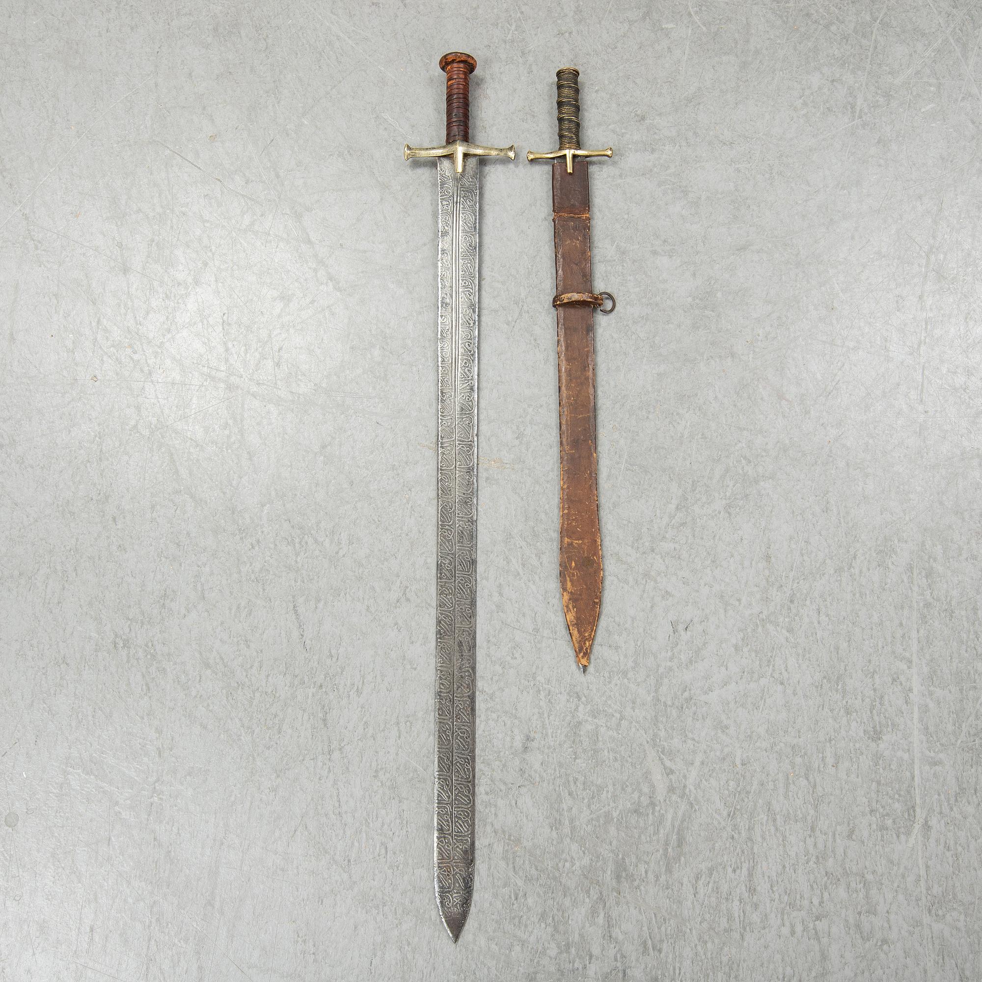 Two East African Kaskara swords- One with scabbard. 19-20th Century.