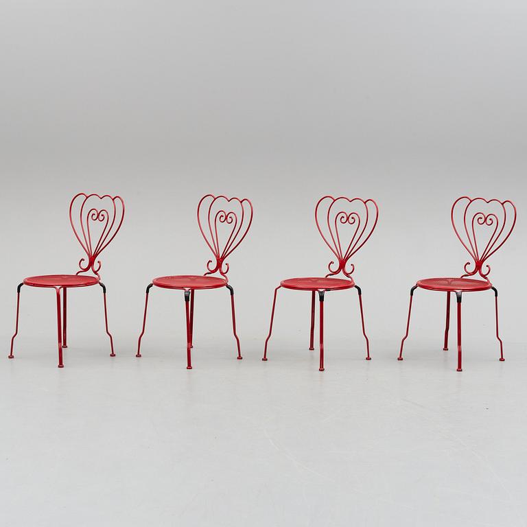 GARDEN FURNITURE, a table and four chairs, late 20th century.