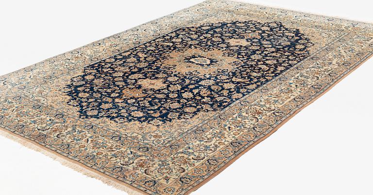 A carpet, semi-antique, part silk Nain, so called 4 Laa, ca 320 x 210,5 cm.