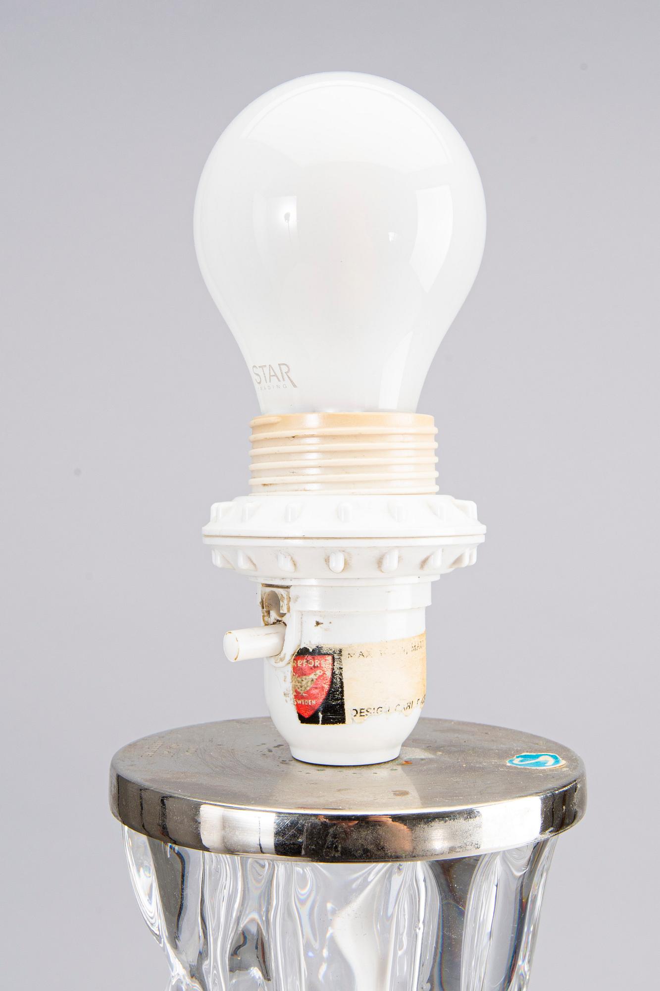 CARL FAGERLUND, a pair of glass table lamps, Orrefors 1477.