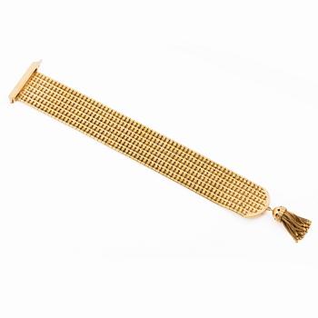 Armband 18K guld med tofs, 1900-talets andra hälft.