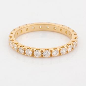 Brilliant cut diamond eternity ring.