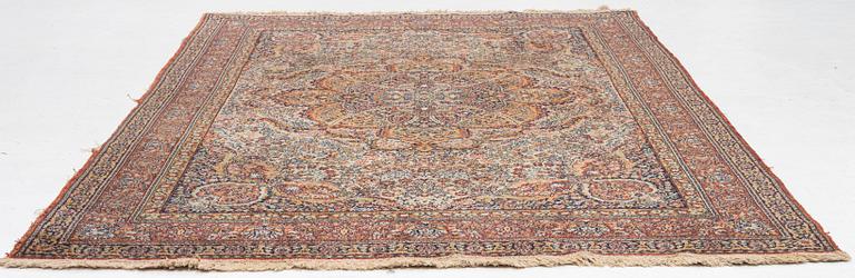 A semi-antique oriental carpet, c. 290 x 195 cm.