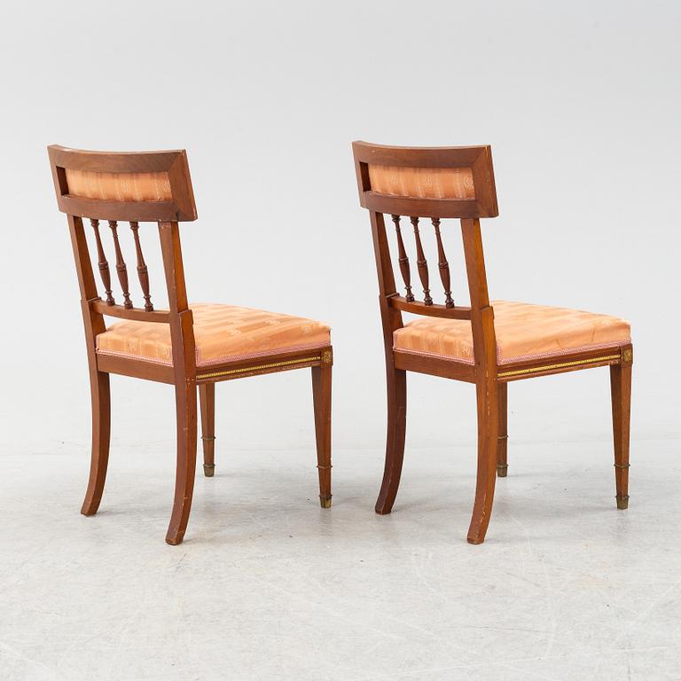 An Empire style table, a sofa and eight chairs, early 20th Century.