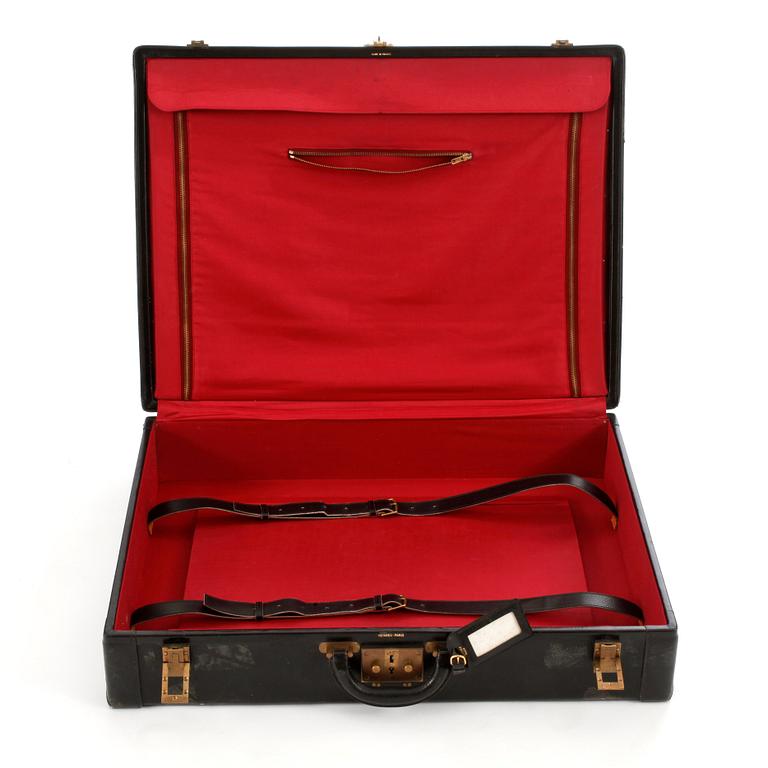 HERMÈS, a black leather suitcase from the 1950/60s.