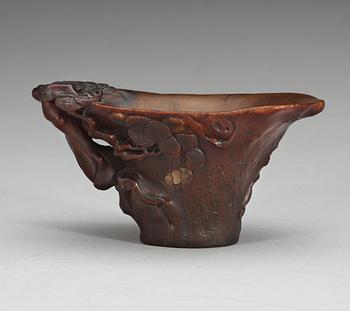 A rhinoceros libation cup, Qing dynasty, ca 1700.