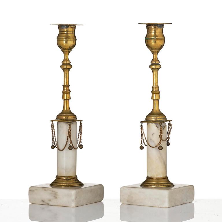 A pair of late Gustavian marble and gilt brass candlesticks, late 18th century.