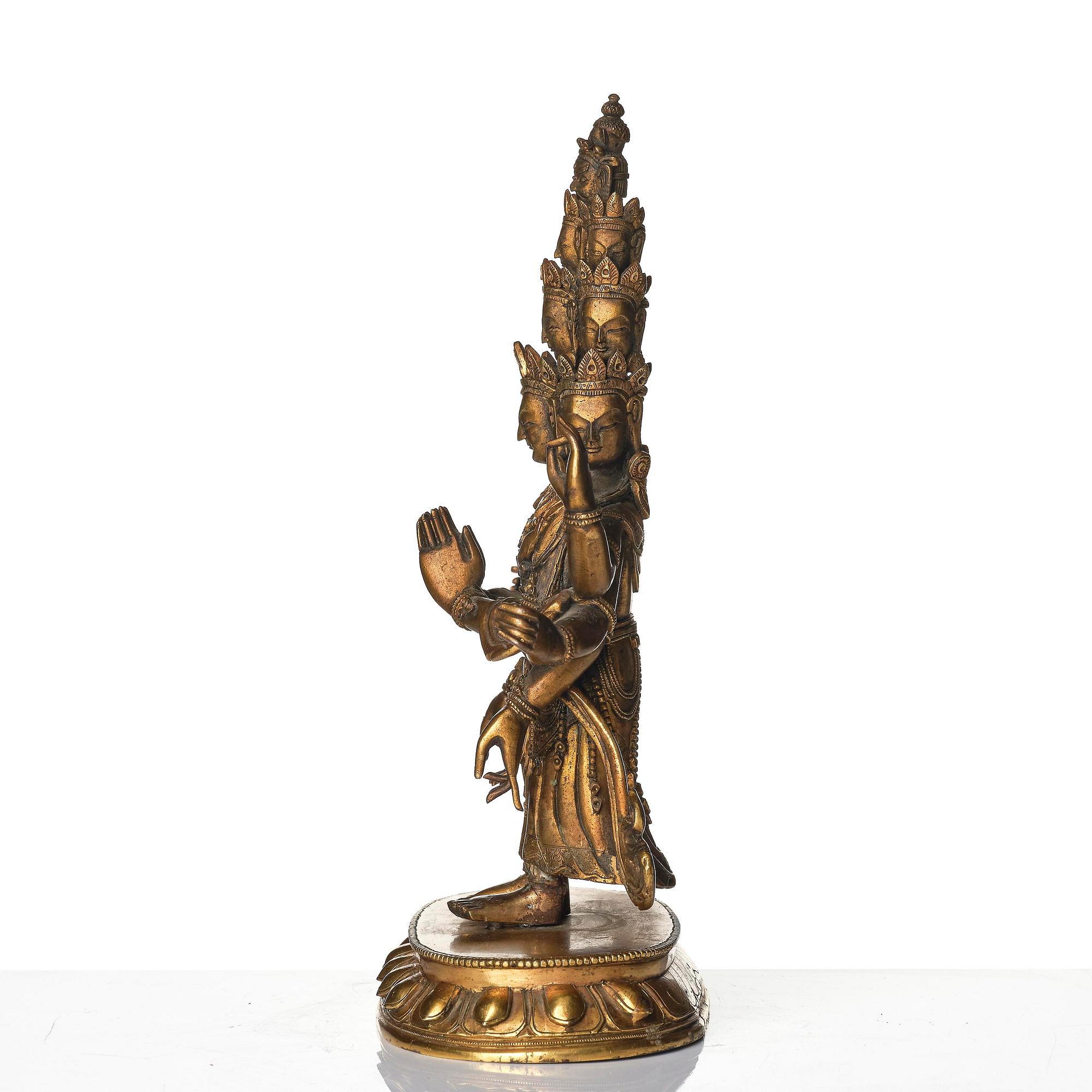 A Tibeto-Chinese gilt bronze figure of Avalokiteshvara Ekasdashamukra, 19th century.