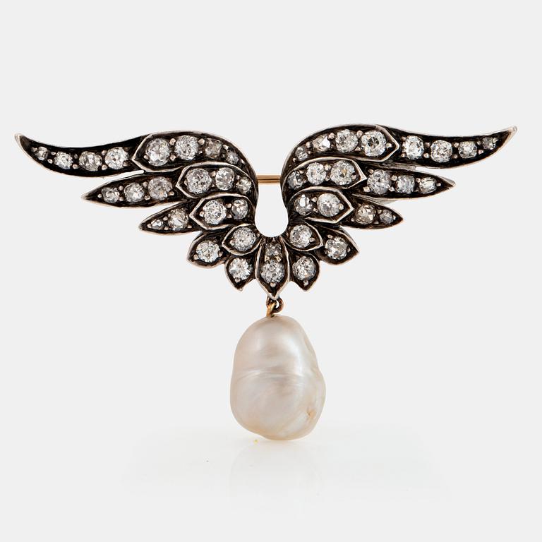 A silver and 14K gold brooch set with old-cut diamonds and a drop shaped pearl.