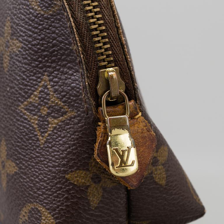a LOUIS VUITTON make-up bag.