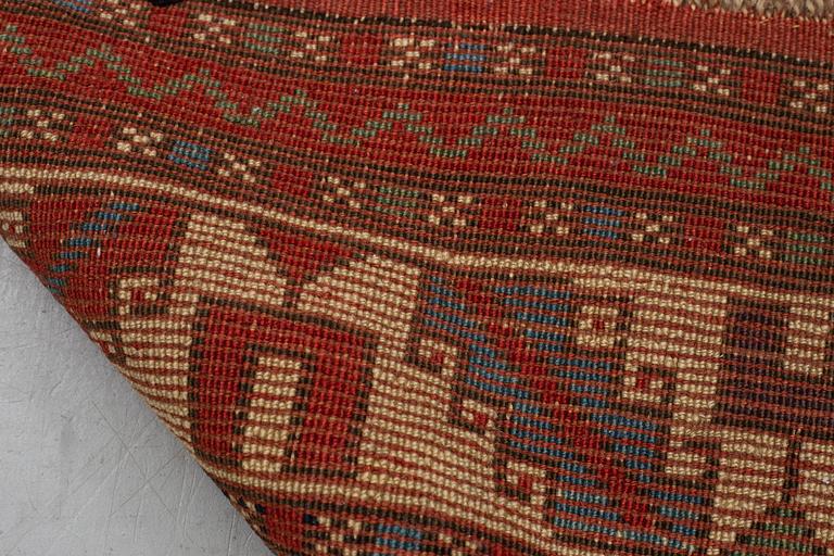 A rug, antique Anatolian/Caucasian, ca 148-149 x 104,5-110 cm (as well as 1-1,5 cm flat weave at one end).