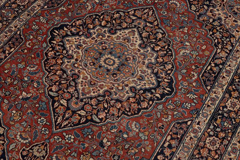 An oriental rug, c. 180 x 140 cm.