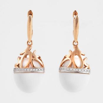 A pair of brilliant cut diamond and white agate earrings.