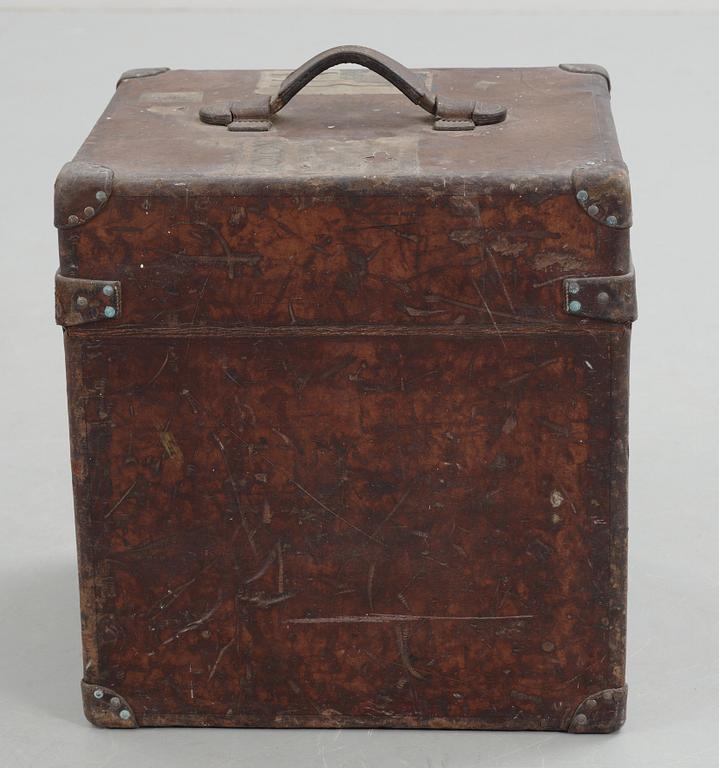 A early 20th cent brown leather trunk by Louis Vuitton.