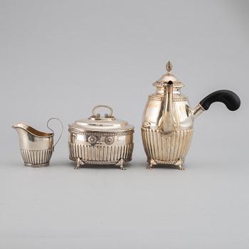 A swedish silver coffee pot, creamer and sugar box, J.E. Torsk, Stockholm 1900.