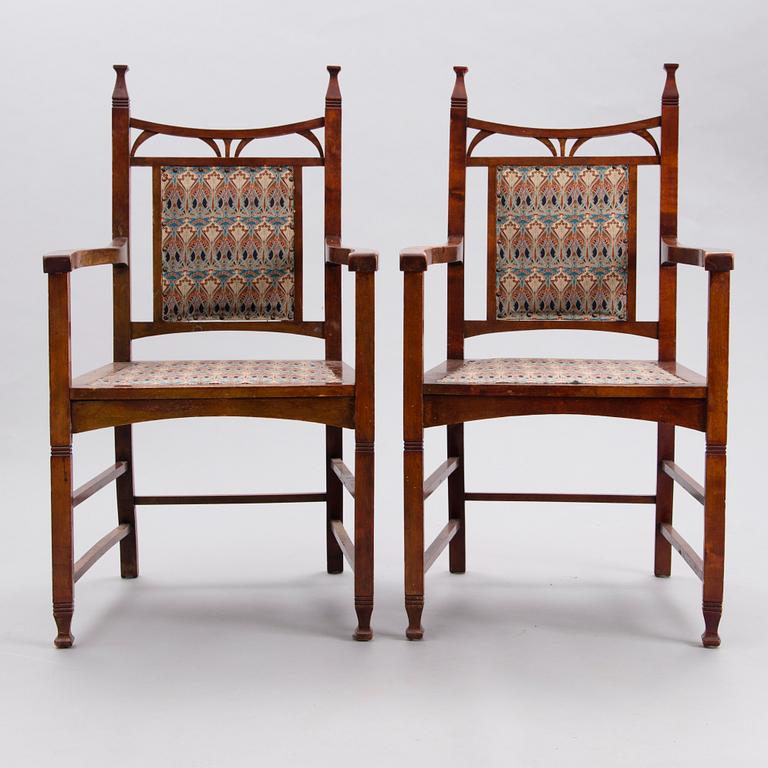 A pair of early 20th Century Jugend style open armchairs.