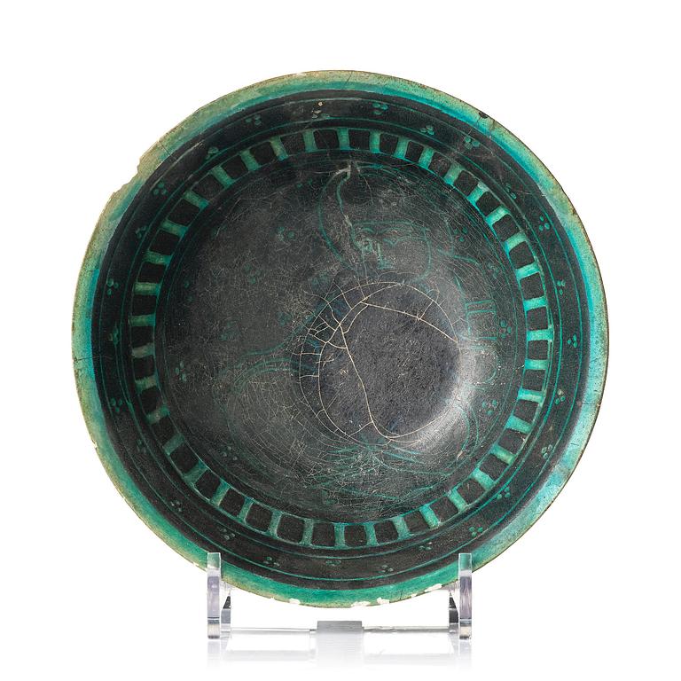 A conic Kashan pottery bowl, central Persia, 11th century.