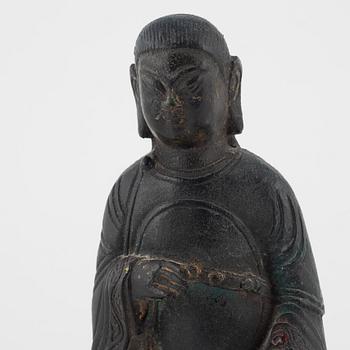 A bronze sculpture of a seated deity, Ming style, probably 20th Century.