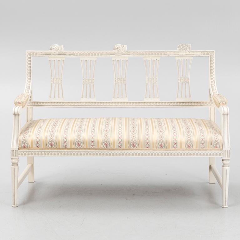 A sofa, three chairs and a table, Gustaivan style and of the Gustavian period, 19th-20th century.
