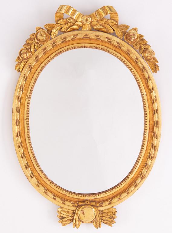 A gustavian style mirror by Erland Tidblad and gilded by Åke Sandelius i the second half of the 20th century.