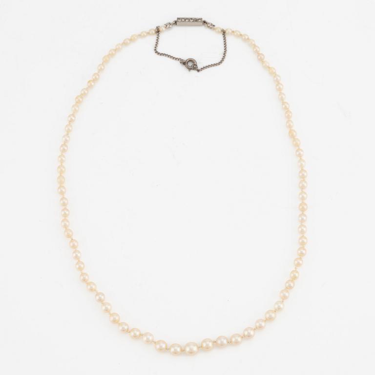 Necklace with cultured graduated pearls, white gold clasp with rose-cut diamonds.