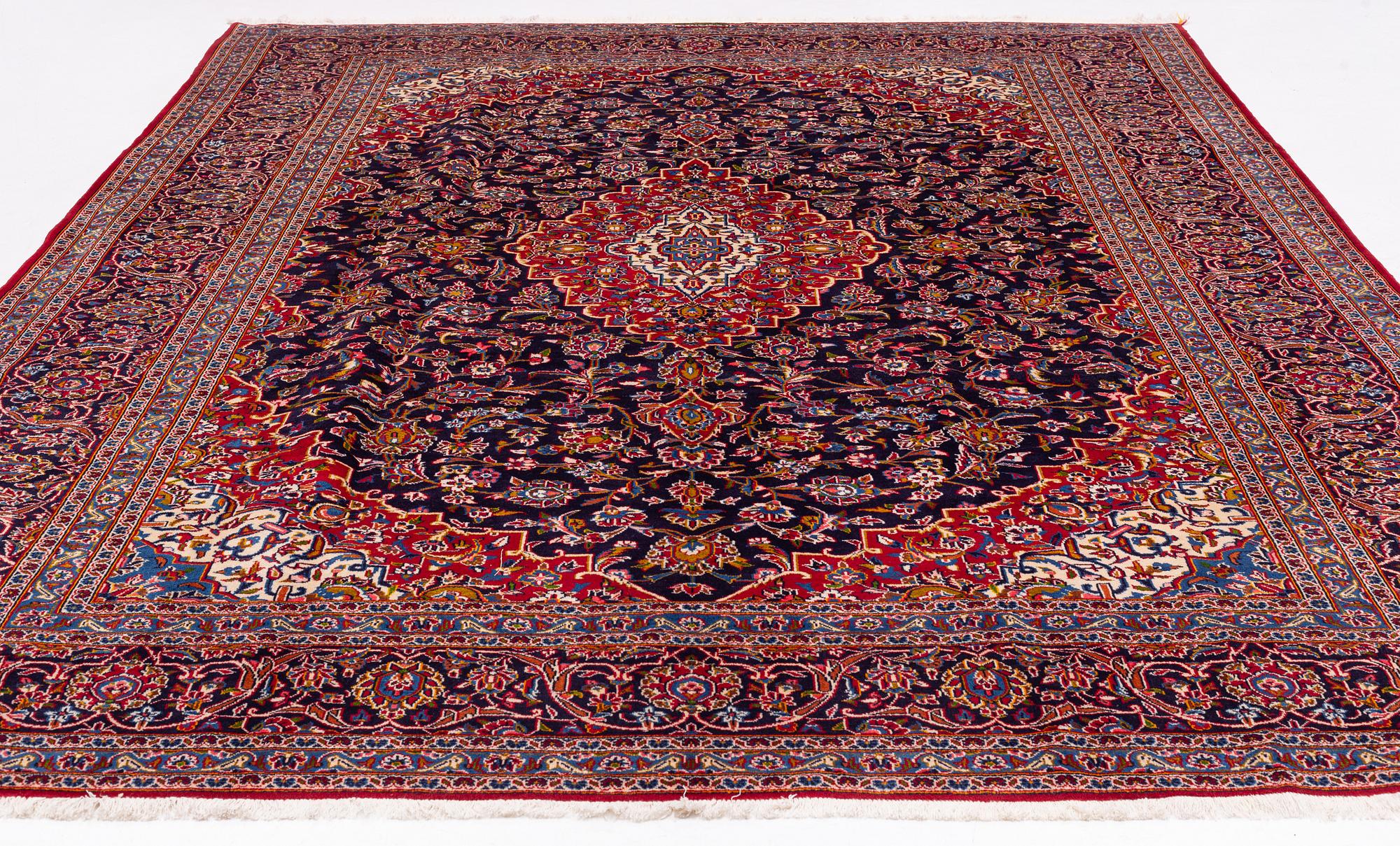 A Kashan carpet signed, approx. 420 x 292 cm.