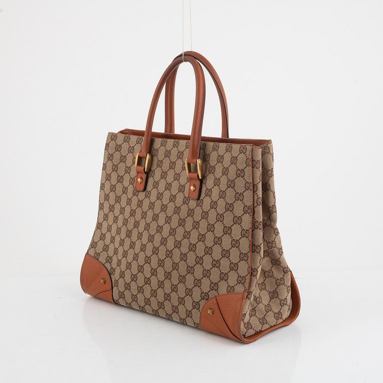 Gucci, a canvas and leather bag.