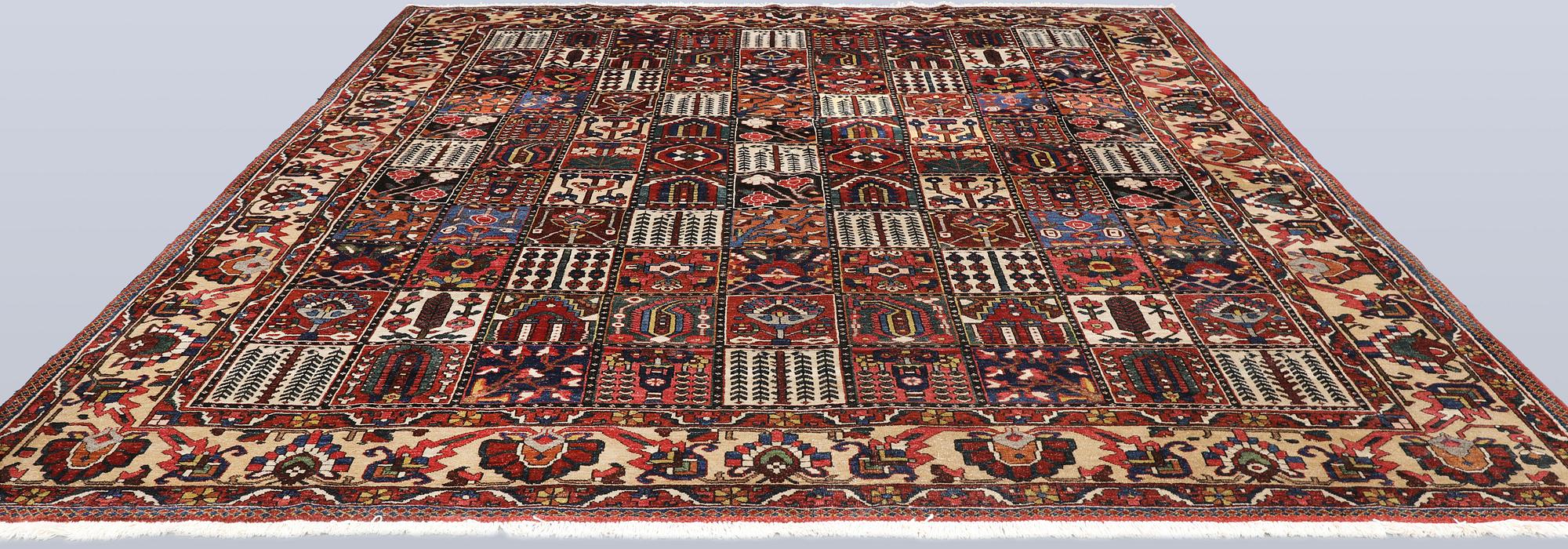 A semi-antique Baktiari carpet, approx. 360 x 308 cm.
