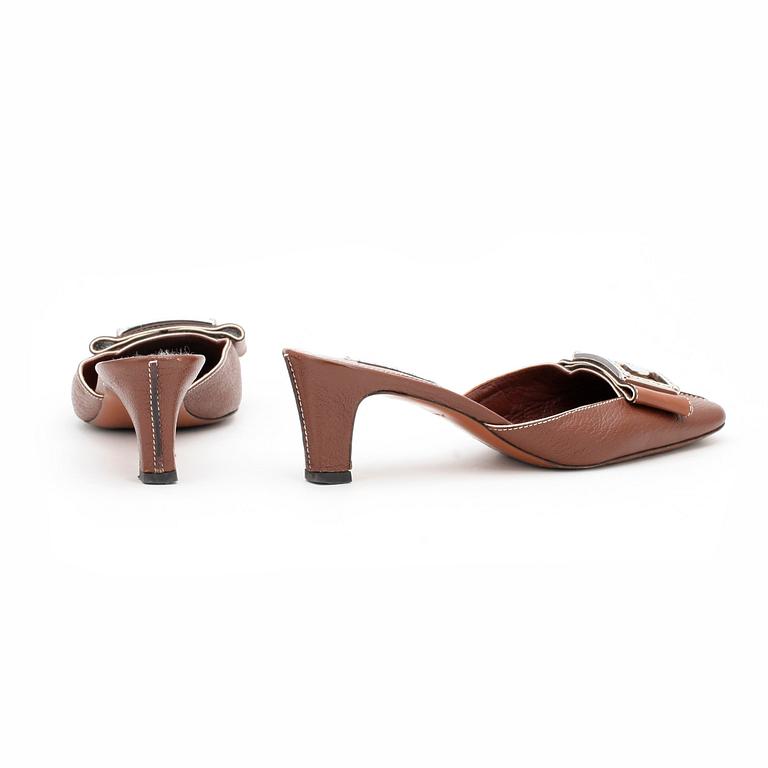 LOUIS VUITTON, a pair of brown leather slip in shoes.