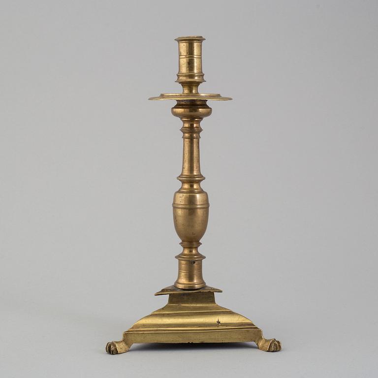 A 17th century bronze candlestick.