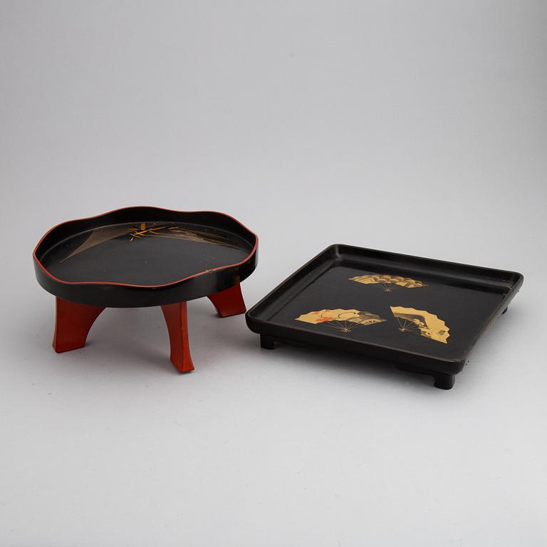 Two Japanese red and black hiramakie lacquer trays, first half of the 20th century.