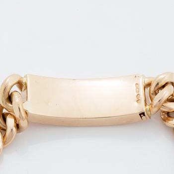 A 14K gold bracelet.