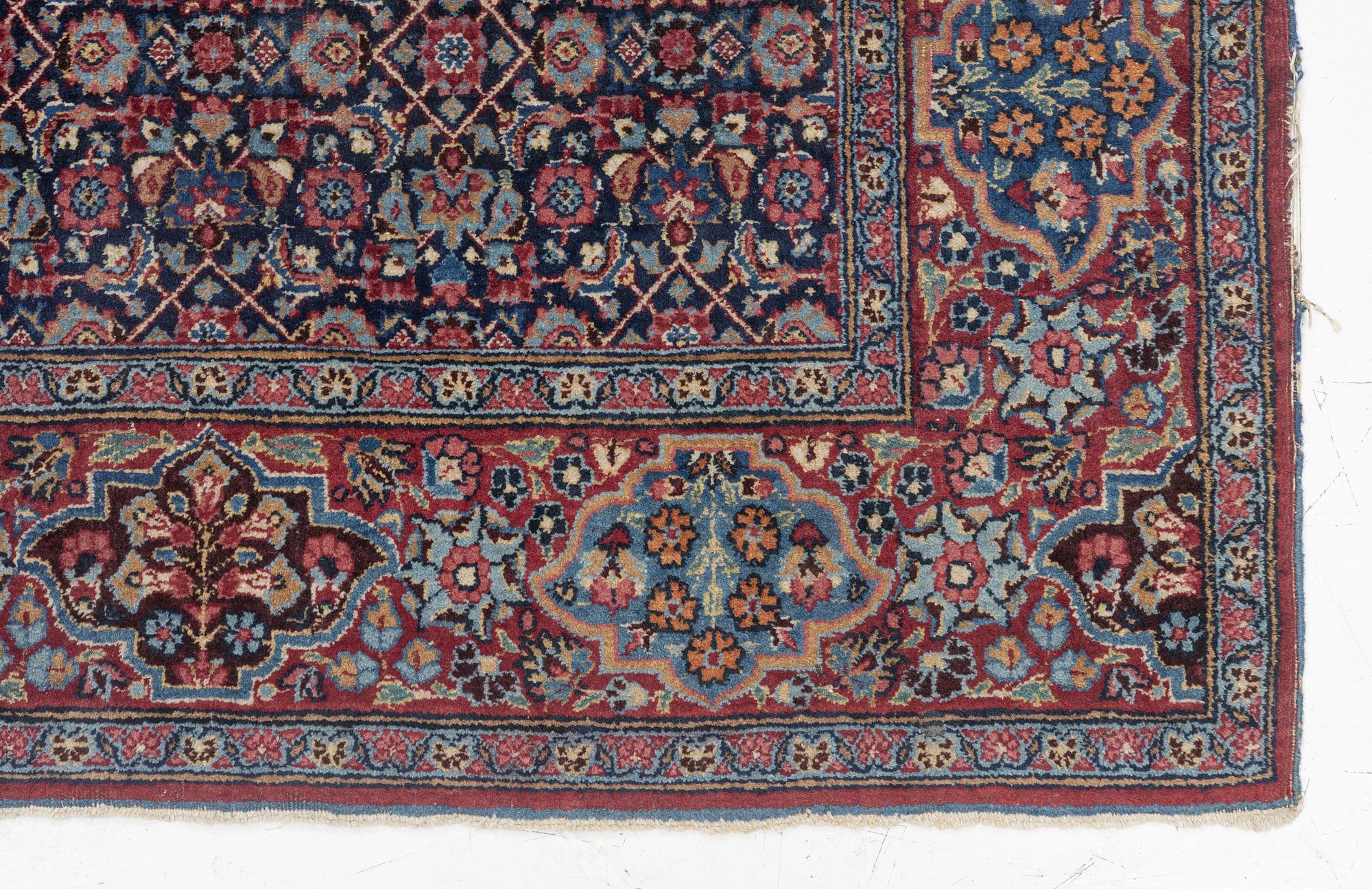 A rug, probably Meshed, semi-antique, c. 180 x 125 cm.