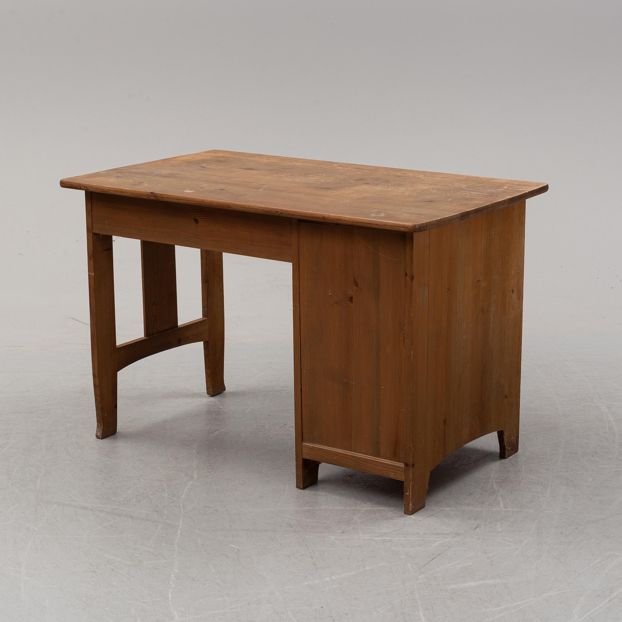A stained pine writing desk attributed to Carl Westman, early 20th Century.