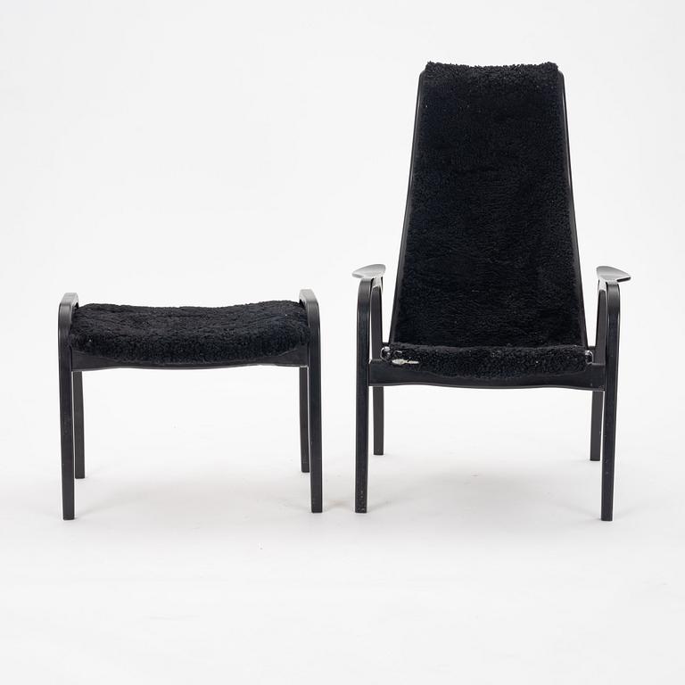 Yngve Ekström, A black "Lamino", easy chair with ottoman, Swedese, Sweden 21st Century.