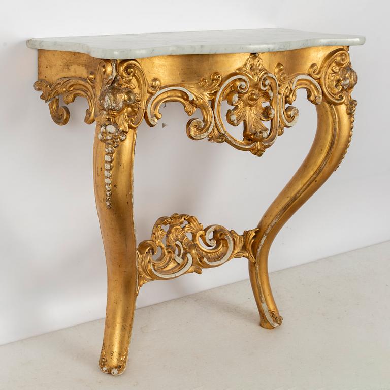 A Rococo revival mirror and a console table, second half of the 20th Century.