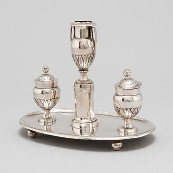 A 19th Century silver inkwell with candle holder.