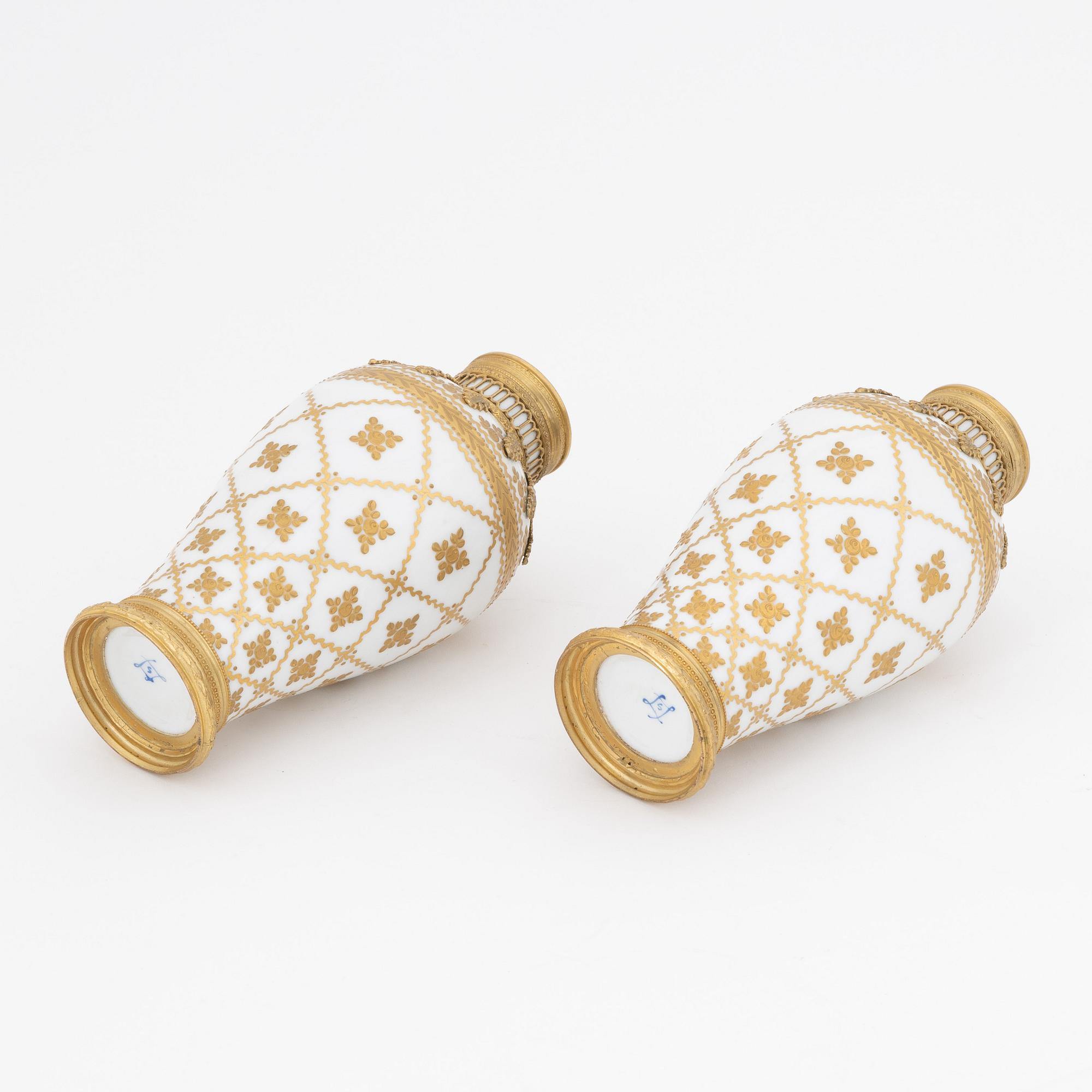 A pair of brass-mounted porcelain  vases, Sèvres mock marks, around 1900.