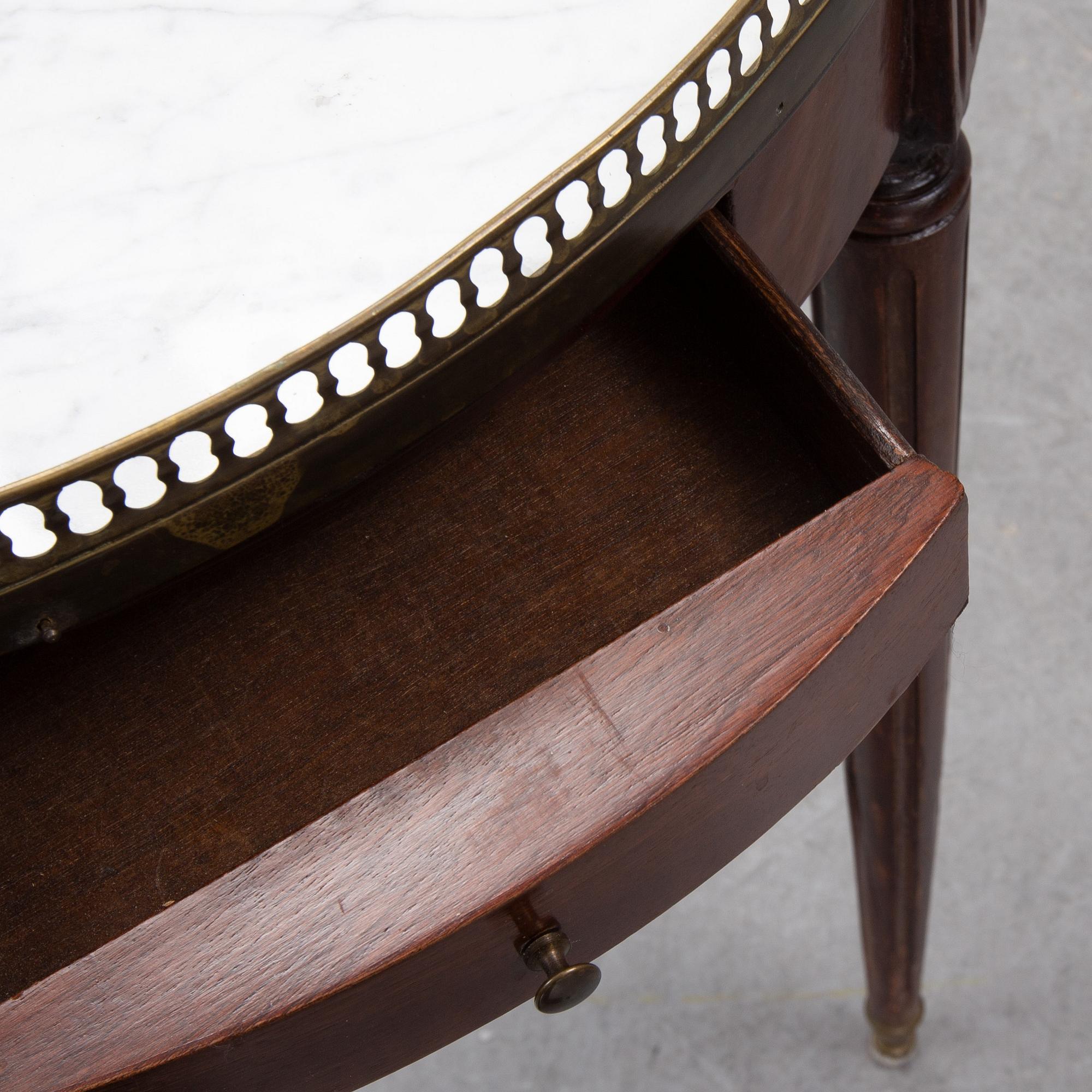 A Louis XVI style marble top mahognay table, circa 1900.