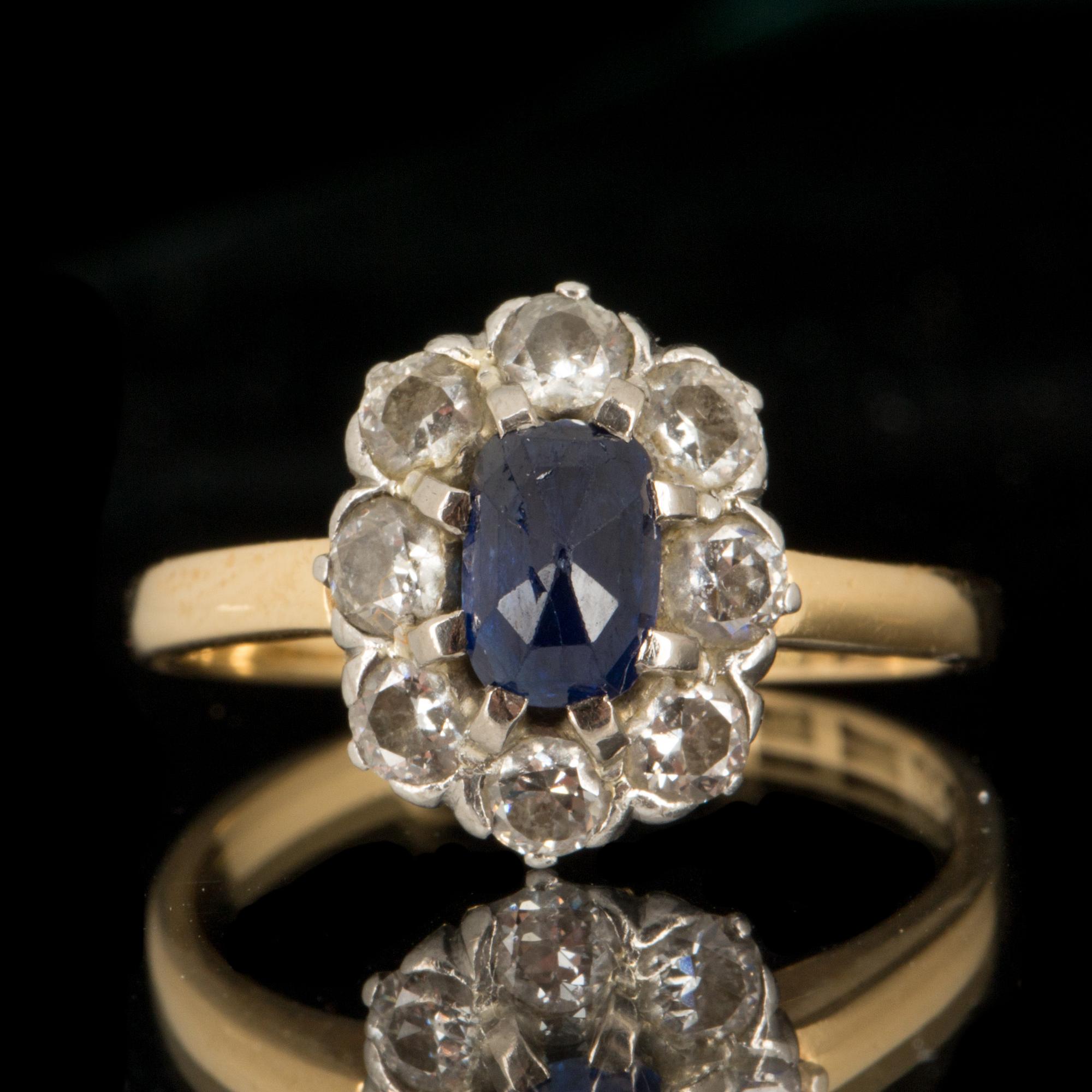 RING, 18k guld med diamanter totalt ca 0,50 ct, och blå sten. Hugo Strömdahl Stockholm, 1951. Vikt ca 2 gram.