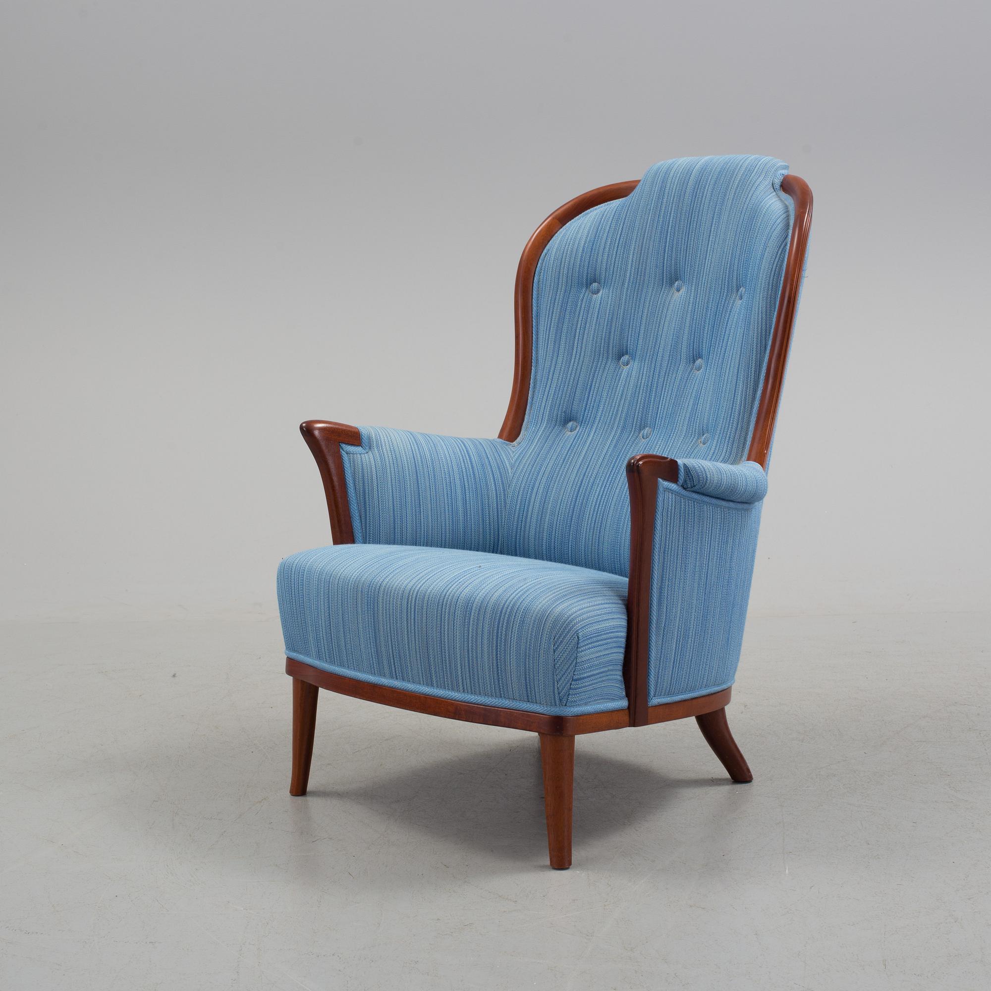 An "Vår Fru" armchair by Carl Malmsten.