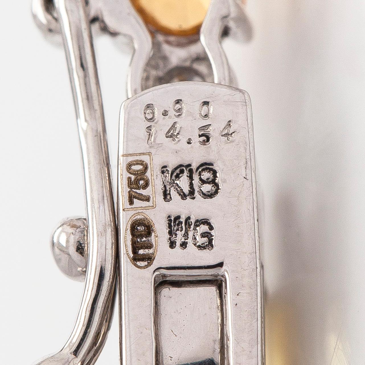 An 18K white gold necklace with multi-coloured sapphires and diamonds.