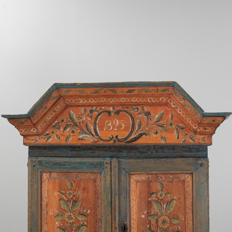 A painted cabinet, dated 1825.
