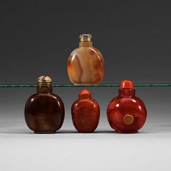1387. A set of four glass and stone snuff bottles with stoppers.