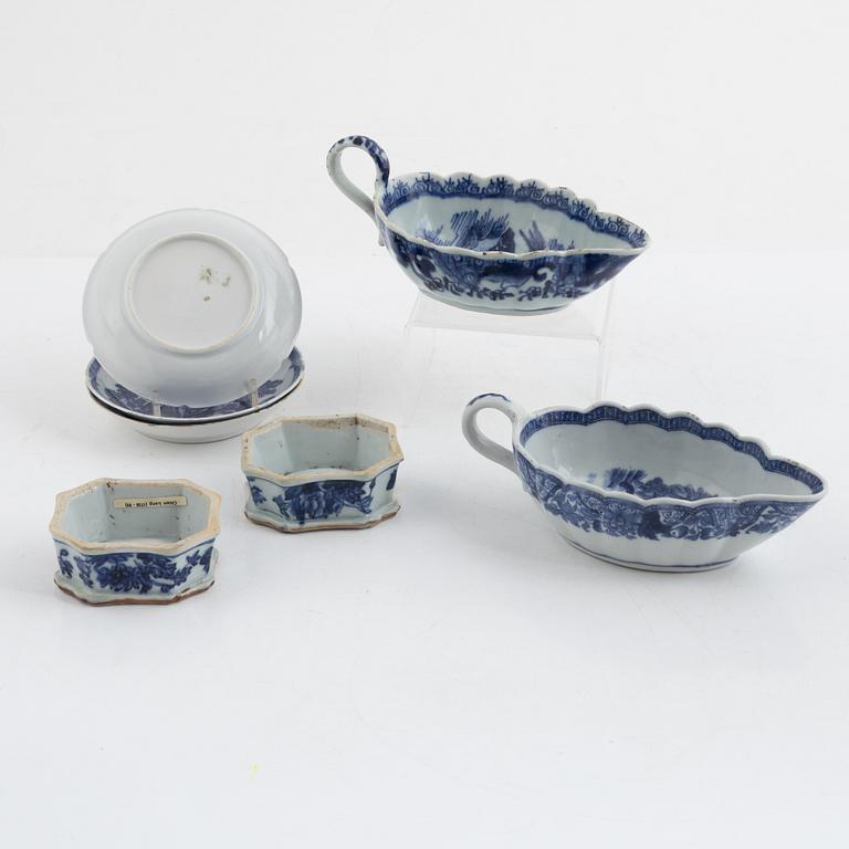 Two Chinese blue and white porcelain sauce boats and a pair of salts, also three small dishes, Qing dynasty, 18th centur.