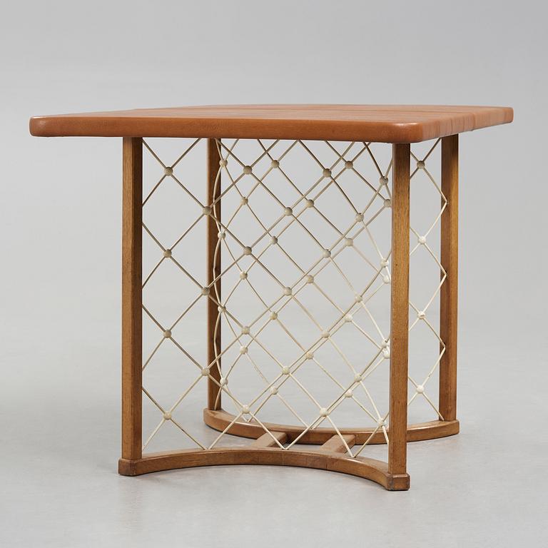 A modernist oak based table, 1940-50's.