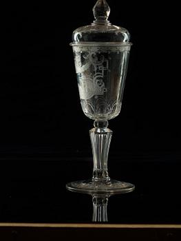 A cut and engraved glass goblet with cover, 18th Century.