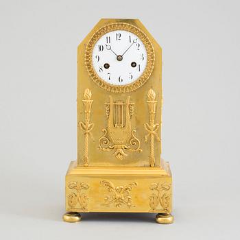 A circa 1800 brass mantel clock.