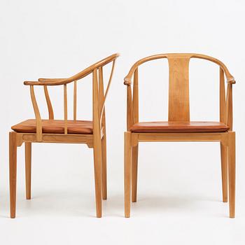Hans J. Wegner, a pair of the " China Chair" in cherry wood, Fritz Hansen, Denmark 1969.