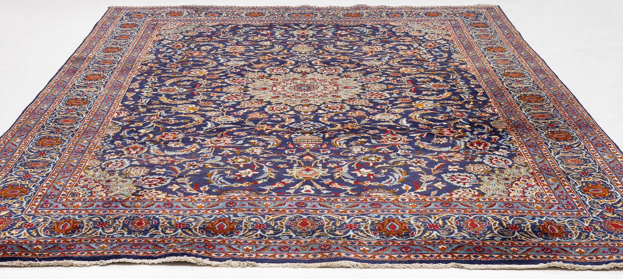 An oriental carpet, c. 390 x 295 cm.
